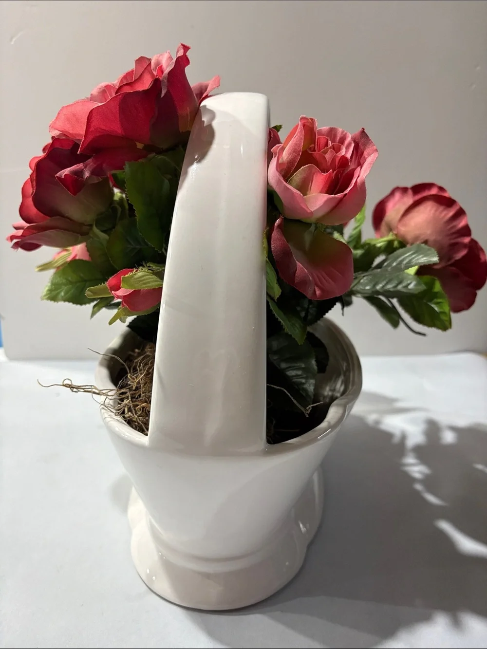 Rose Artificial Arrangement in White Ceramic Basket half moon bay California